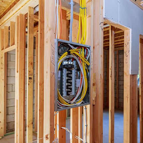 High-quality commercial electrical installation showcasing a professional setup of electrical panels, meters, and conduits.