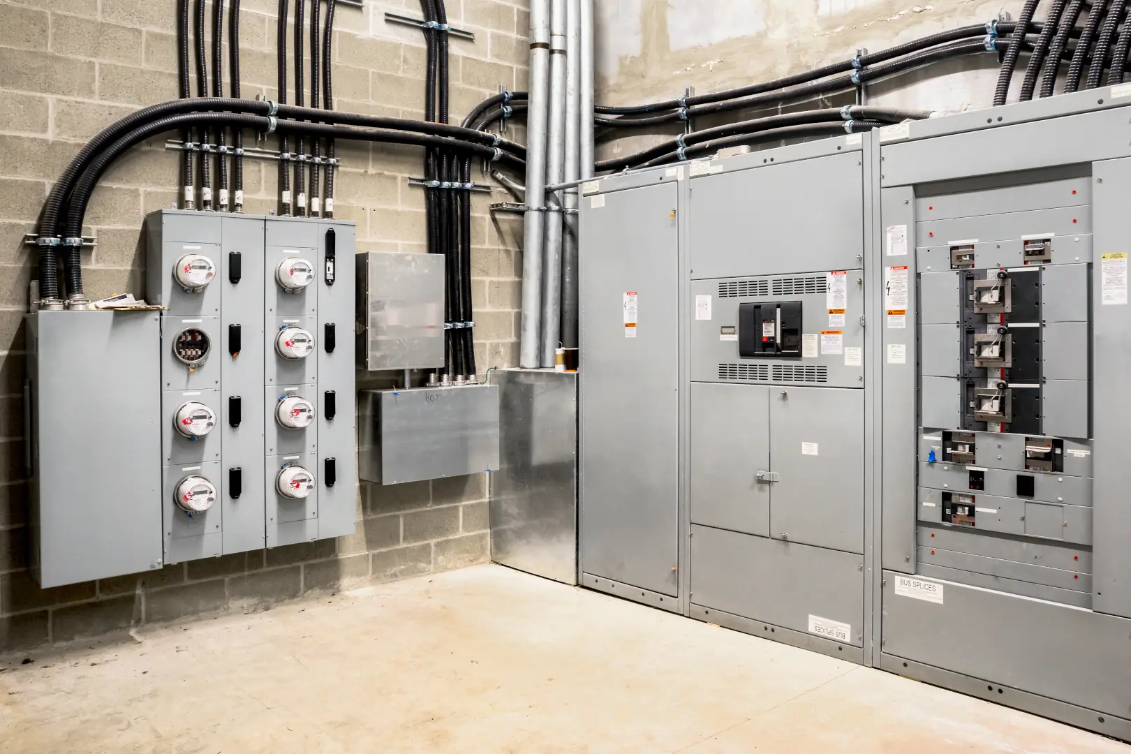 High-quality commercial electrical installation showcasing a professional setup of electrical panels, meters, and conduits.